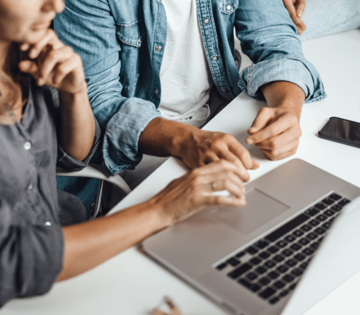 People collaborating with a laptop